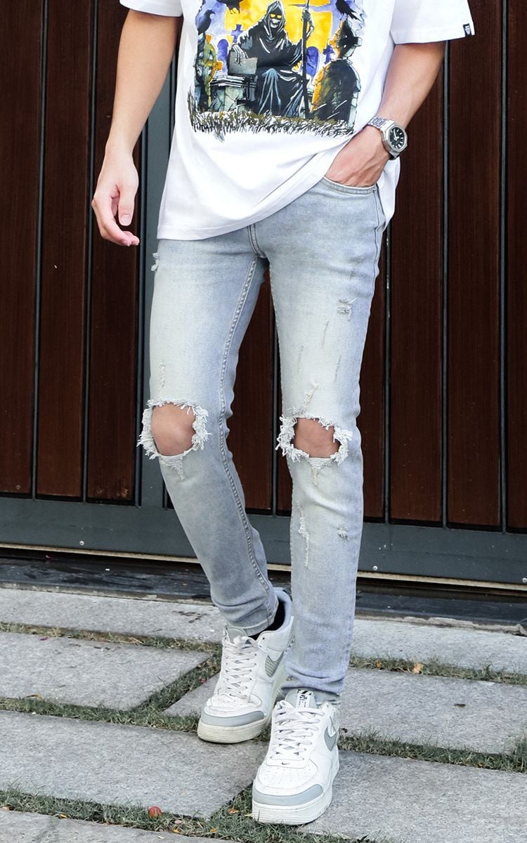 Skinny Jeans With Knee Rips In Mid Wash Blue