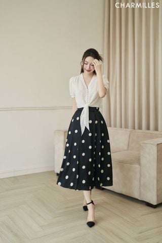 Chân váy chấm bi xếp ly