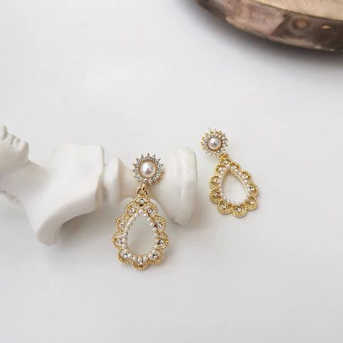 Hoa tai D1709 Hoa tai bầu dục vintage