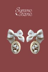 Hoa tai D1801 Nơ kem đá bầu dục