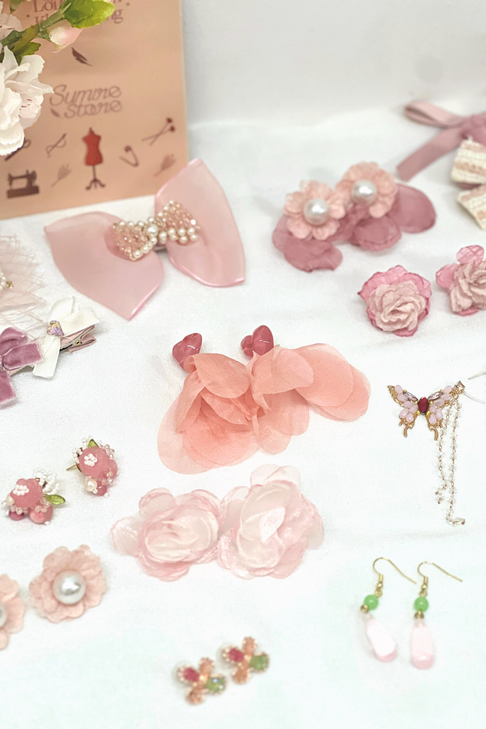 Hoa tai NK-078 trái tim hồng đính ruy băng vải cam