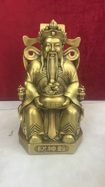 Tượng thần tài dâng tiền
