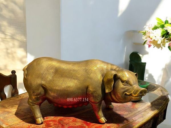 Tượng heo lái bằng đồng