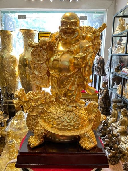 Tượng di lặc cưỡi long quy bằng đồng dát vàng 24K cao 48cm, ngang 36cm, rộng 20cm, nặng 20kg