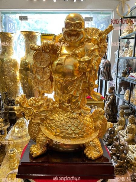 Tượng di lặc cưỡi long quy bằng đồng dát vàng 24K cao 48cm, ngang 36cm, rộng 20cm, nặng 20kg