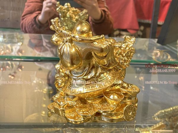 tượng phật di lặc cưỡi long quy gánh tiền dát vàng 24k Cao 12