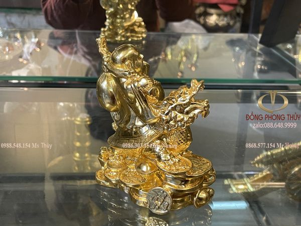 tượng phật di lặc cưỡi long quy gánh tiền dát vàng 24k Cao 12