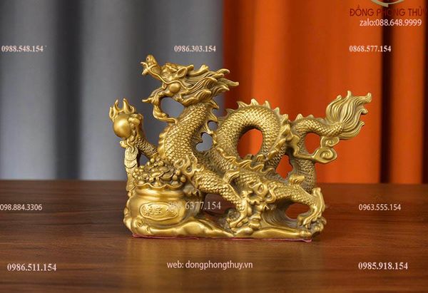 Tượng rồng đế tiền hũ vàng