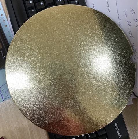 Đế lót bánh giấy tròn vàng cán vân 29cm