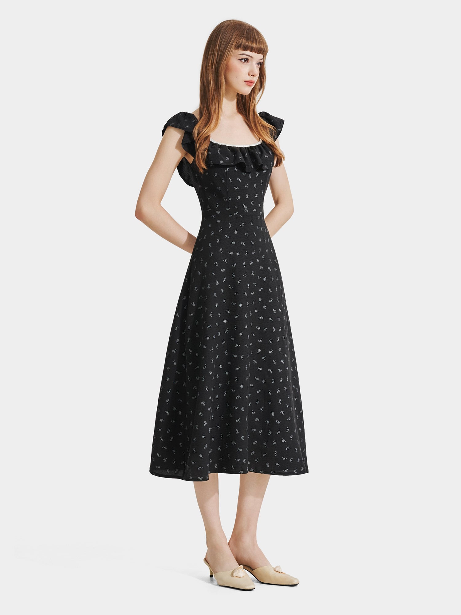 Đầm midi họa tiết nơ sát nách cổ phối bèo