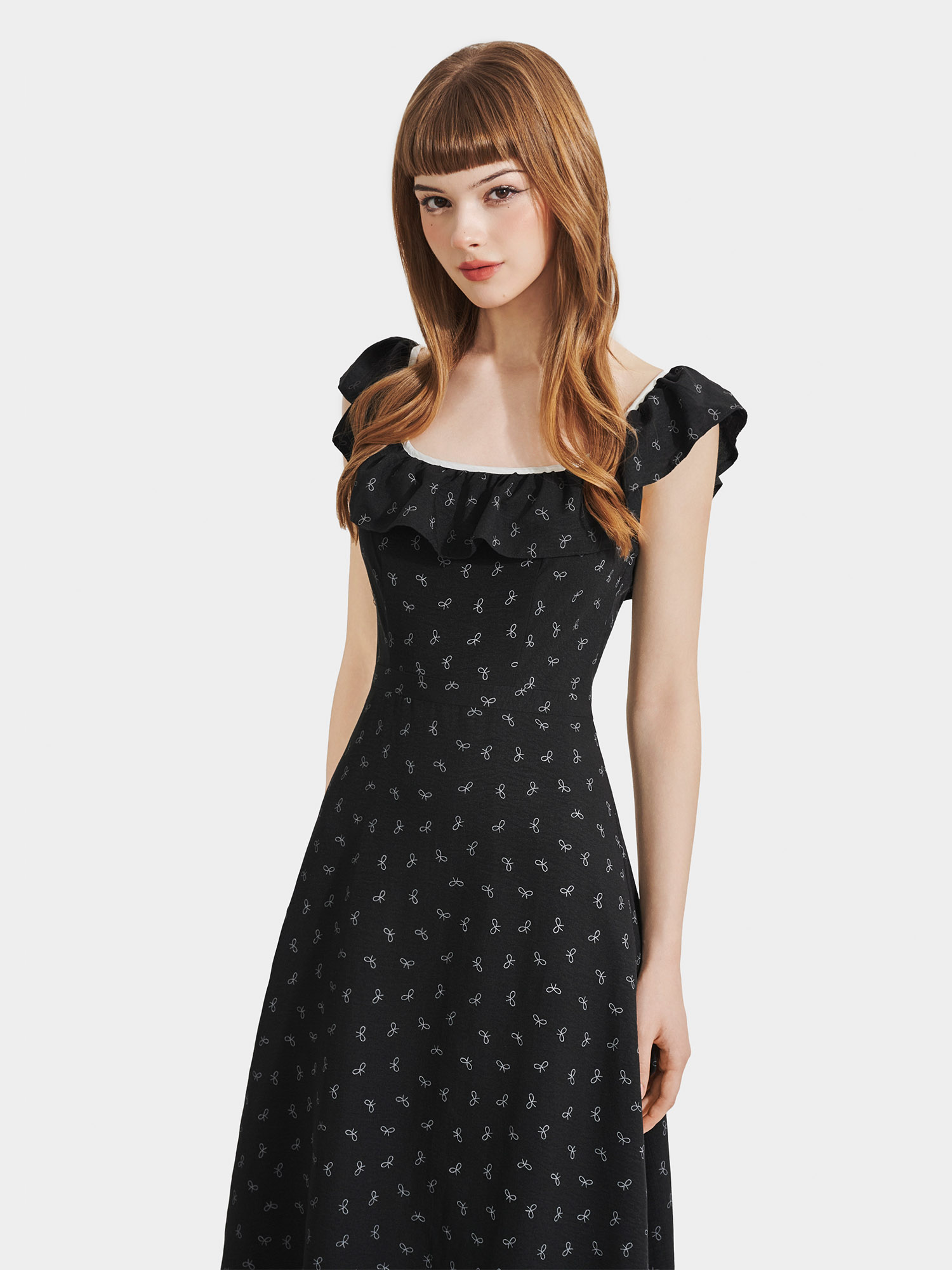 Đầm midi họa tiết nơ sát nách cổ phối bèo