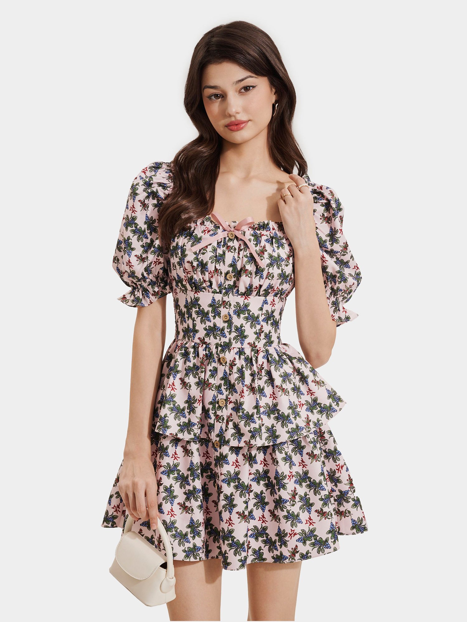 Đầm mini in họa tiết tay phồng nhún thun đính nơ ngực
