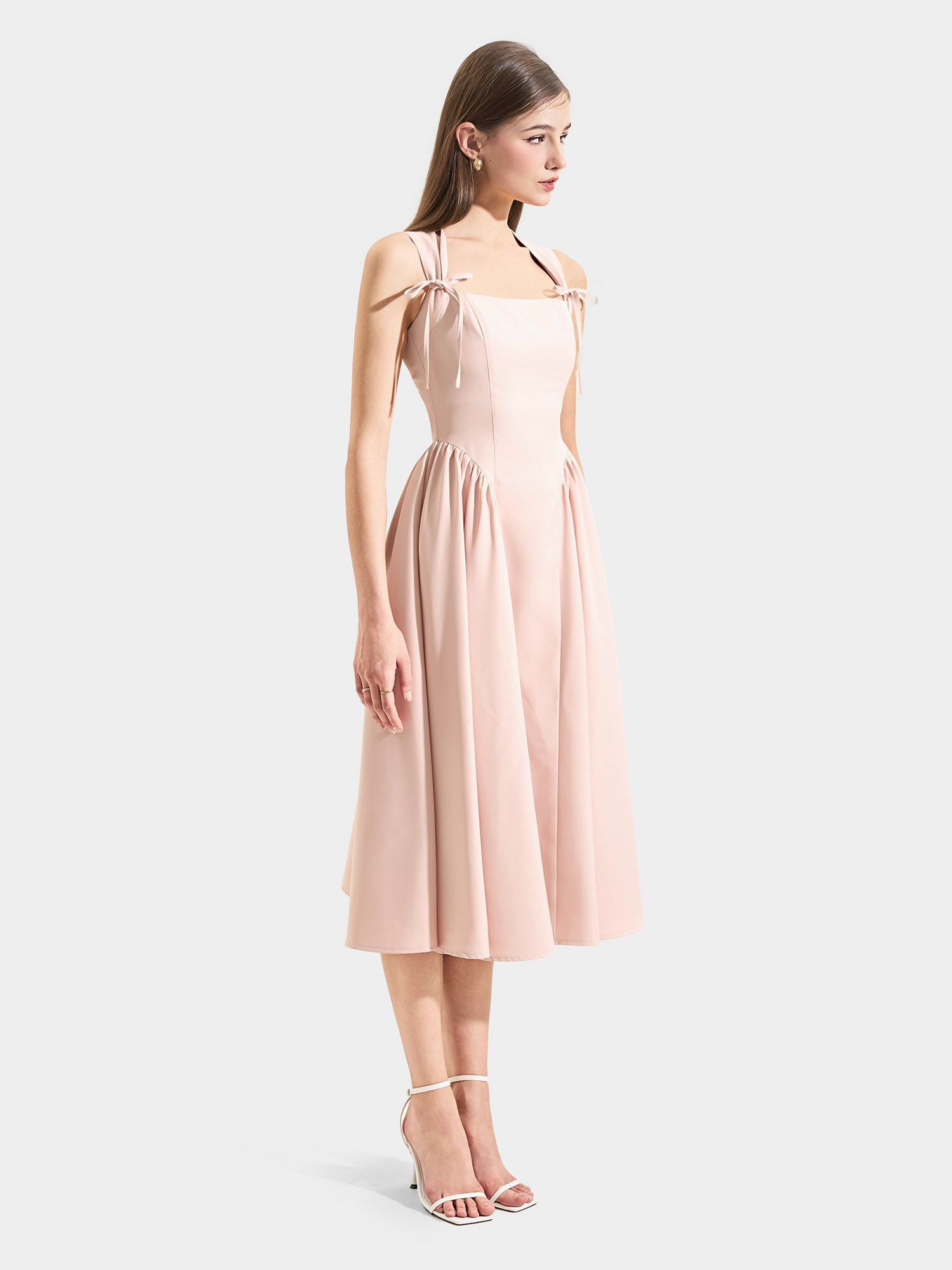  Đầm midi sát nách cổ vuông rã hông nơ ngực 