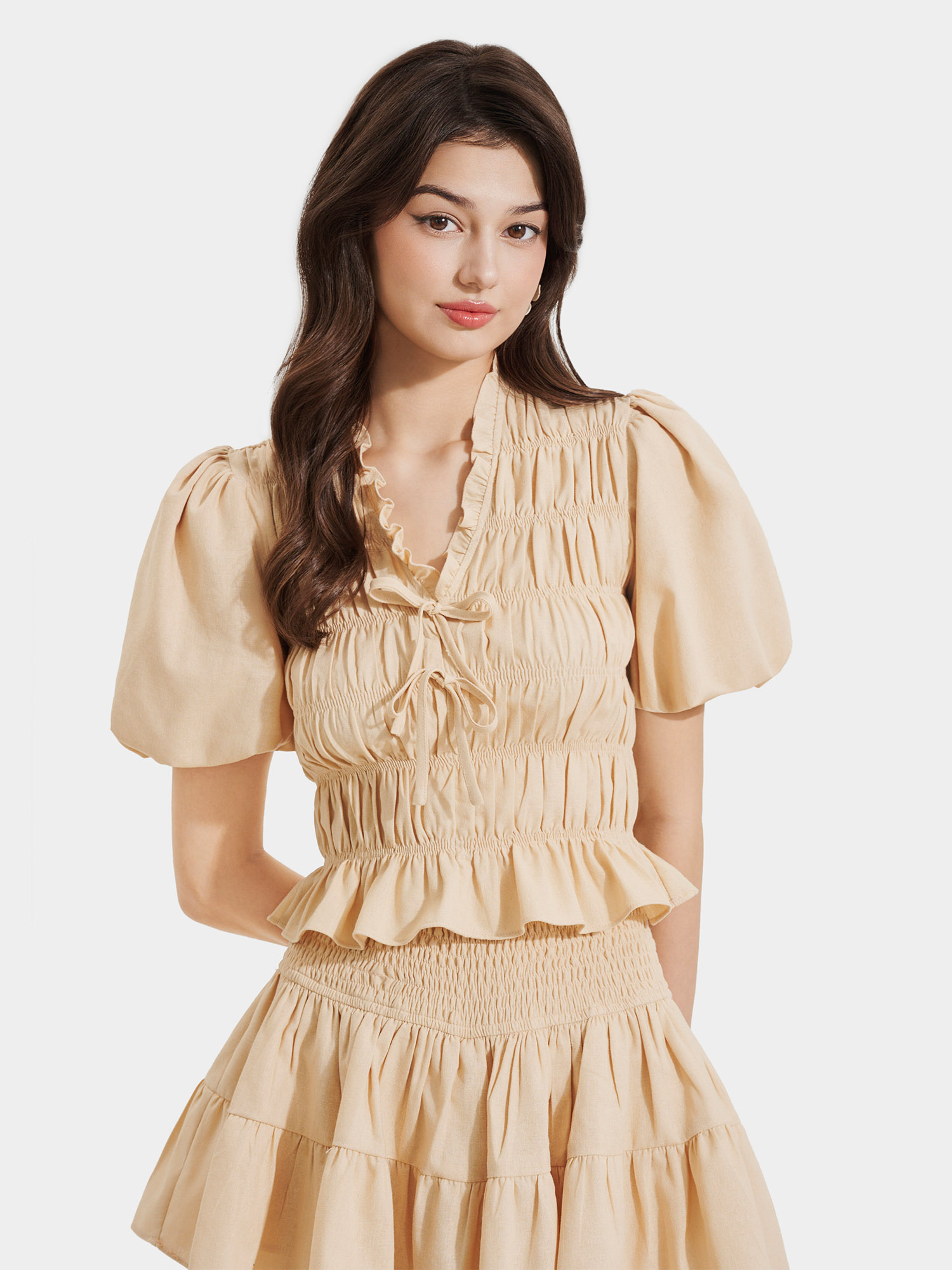 Áo linen tay phồng smocking cổ tim phối bèo đính nơ