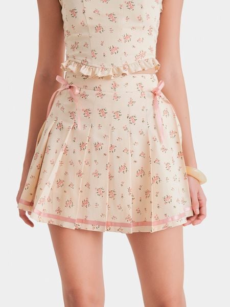  Váy mini kaki hoa xếp li đính nơ hông 