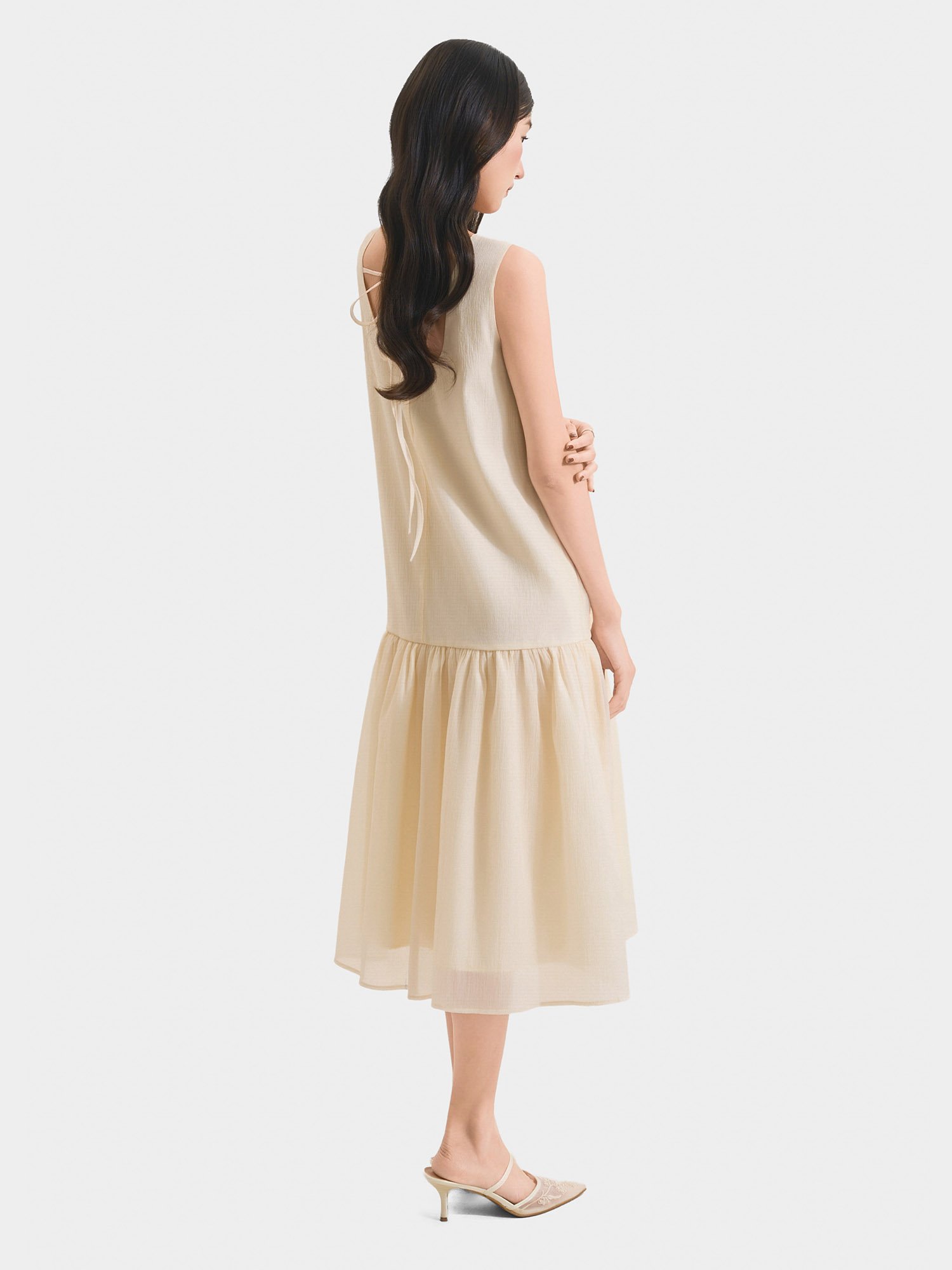 Đầm midi form suông sát nách thắt nơ lưng