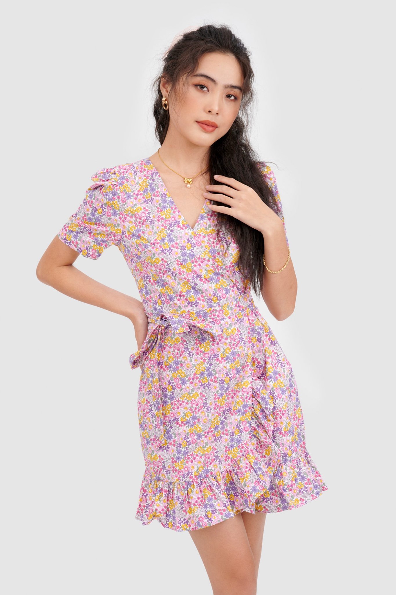 Đầm đắp chéo mini cột nơ hoạ tiết hoa
