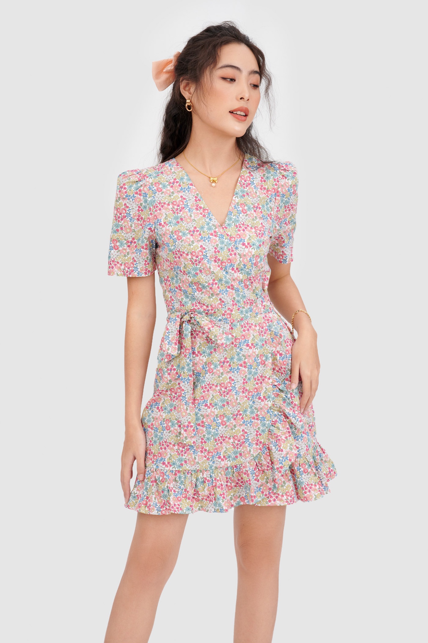 Đầm đắp chéo mini cột nơ hoạ tiết hoa