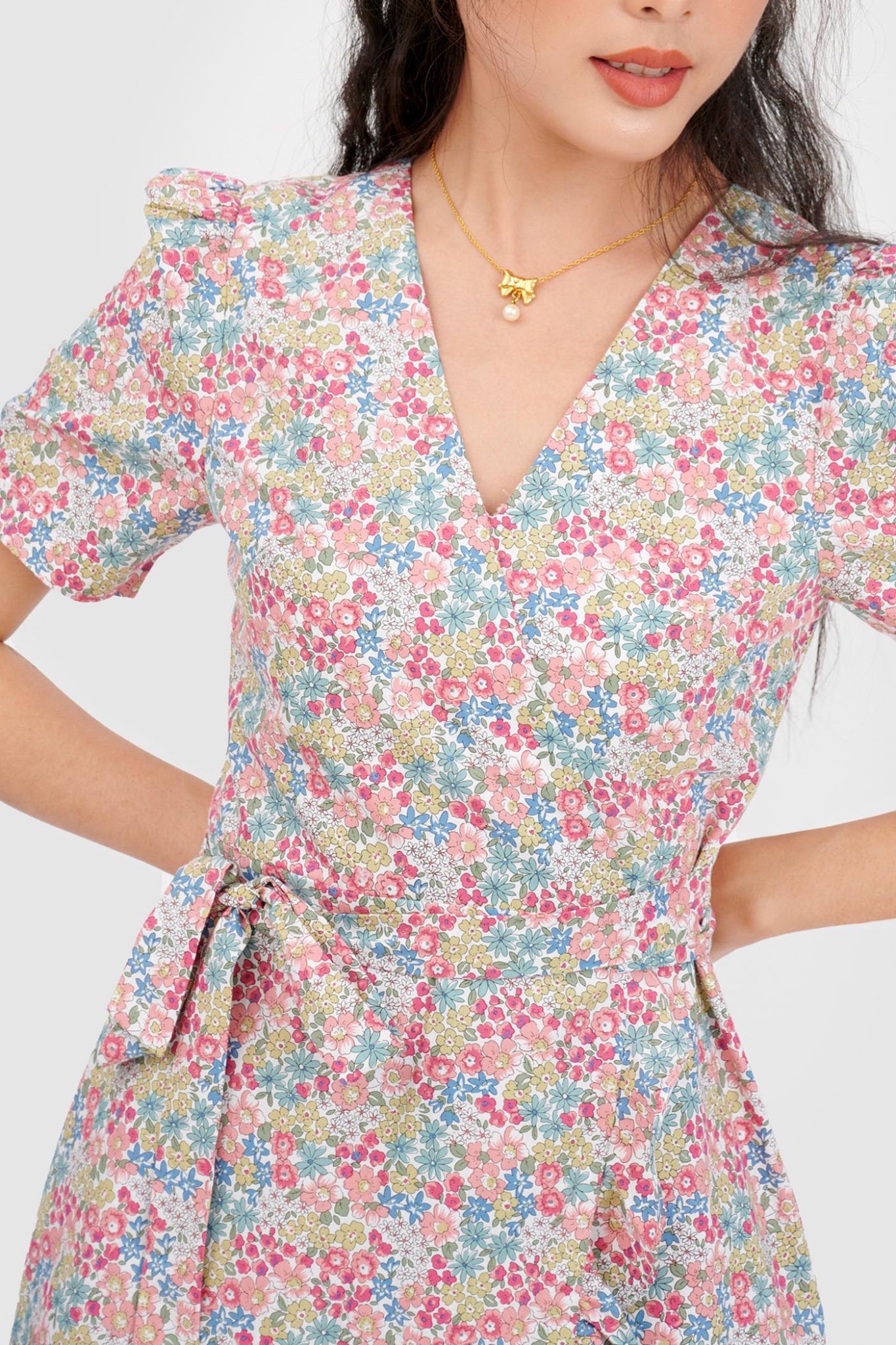 Đầm đắp chéo mini cột nơ hoạ tiết hoa