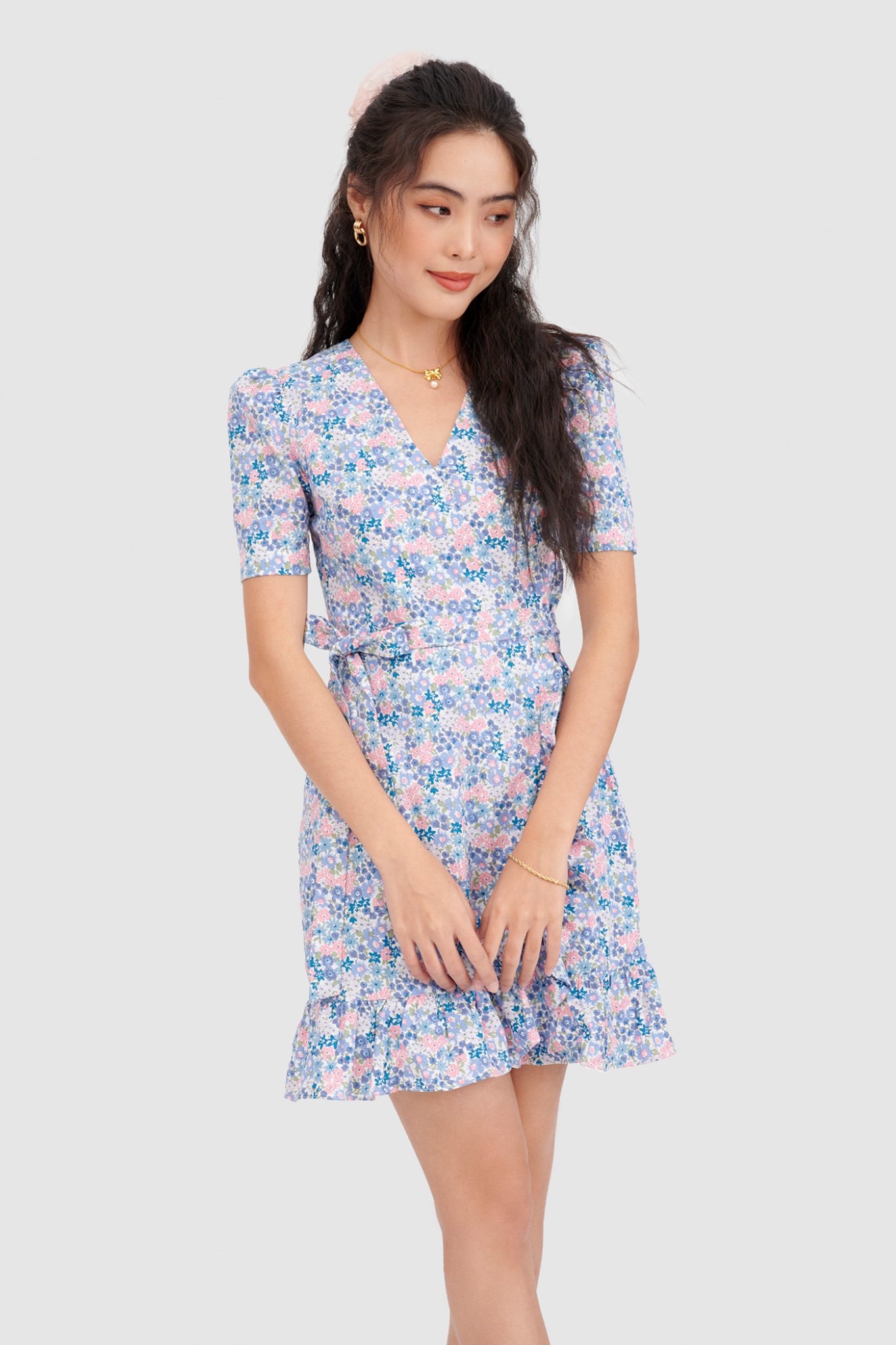Đầm đắp chéo mini cột nơ hoạ tiết hoa