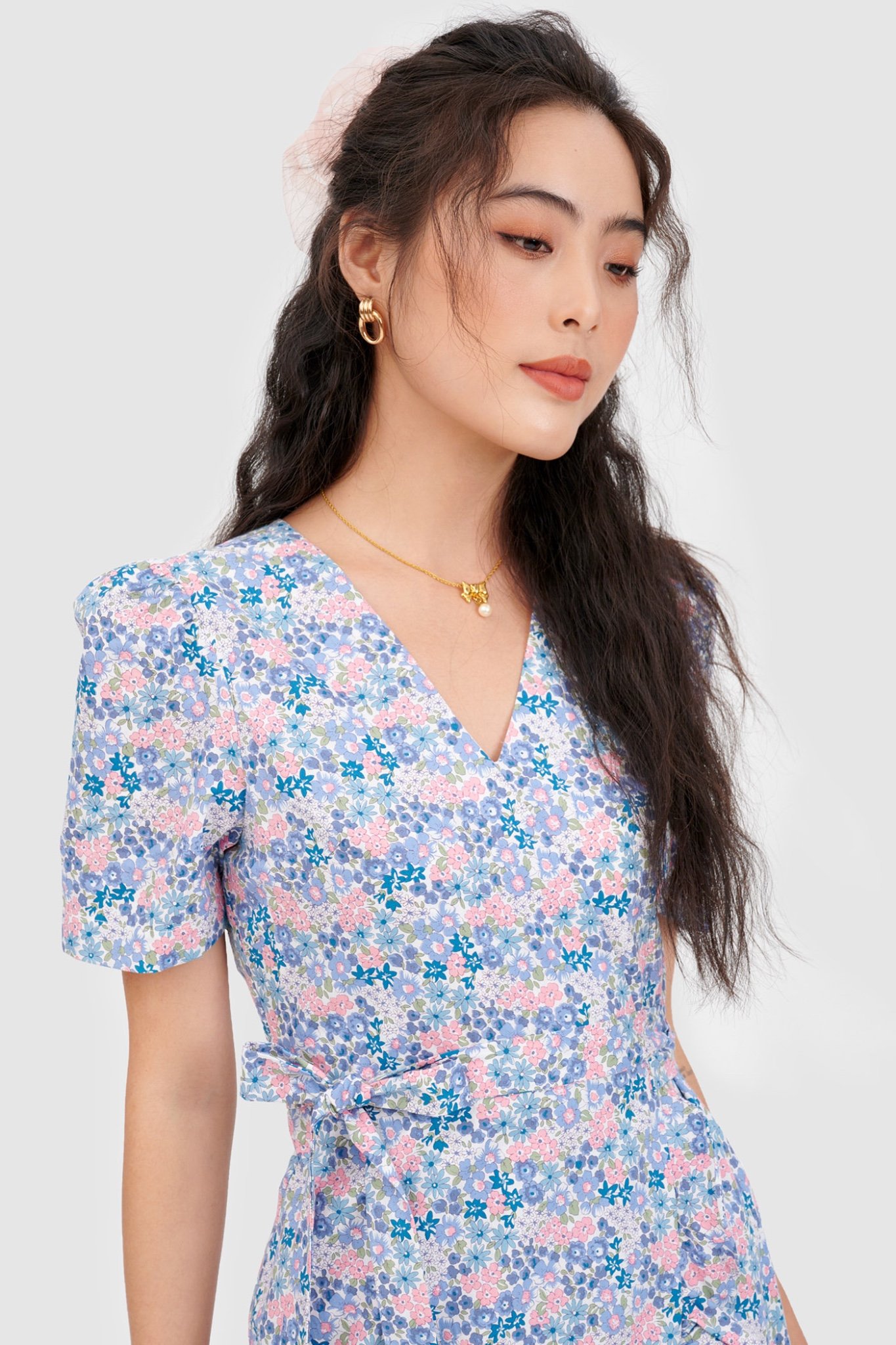 Đầm đắp chéo mini cột nơ hoạ tiết hoa