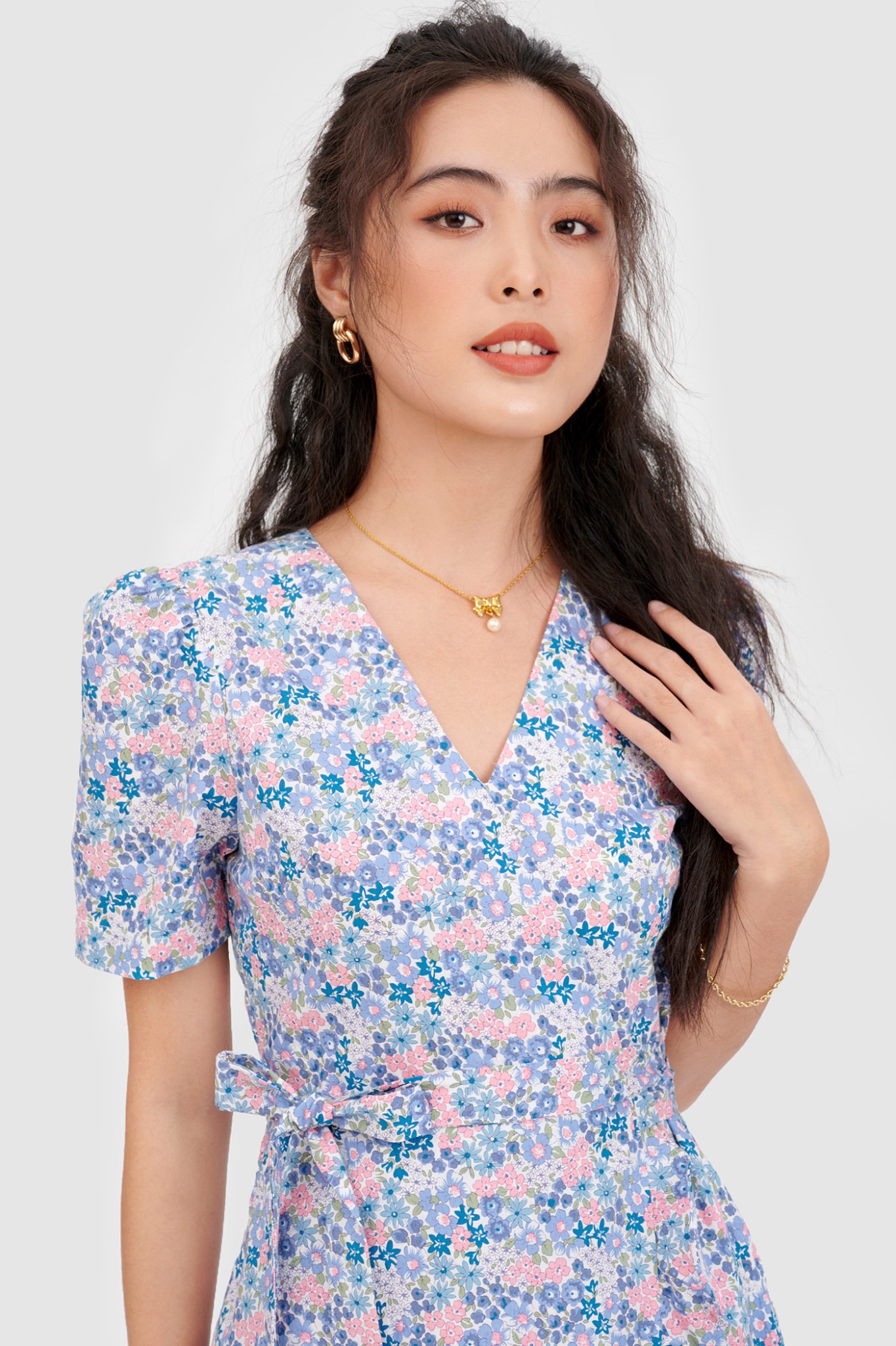 Đầm đắp chéo mini cột nơ hoạ tiết hoa