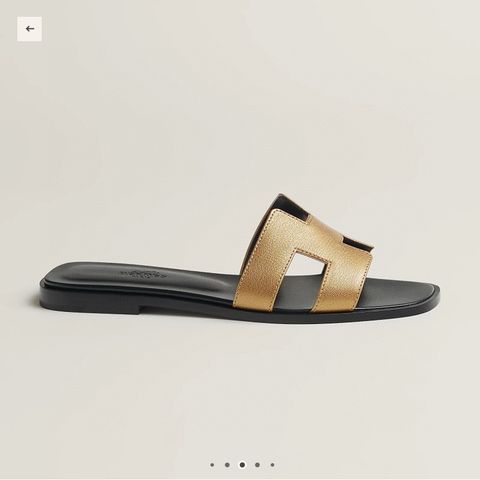 Dép nữ Herme*s vàng đồng Oasis” H‑Sandal