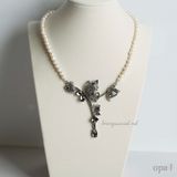  Chuỗi vòng cổ ngọc trai mặt titan đính đá 