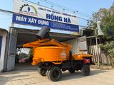 Máy trộn bê tông tự cấp liệu Hồng Hà 15 bao 2 cầu