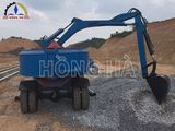 Máy trộn bê tông tự cấp liệu Hồng Hà - Gầu xúc