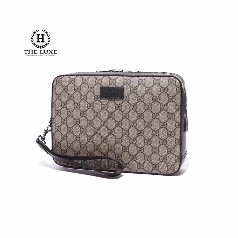 Clutch Gucci vân mono nâu vàng