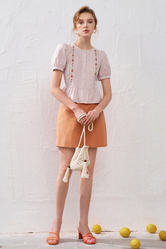 Chân váy mini thô kaki cam khuy kim loại