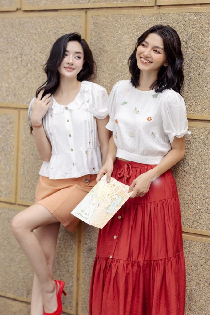 Chân váy mini thô kaki cam khuy kim loại