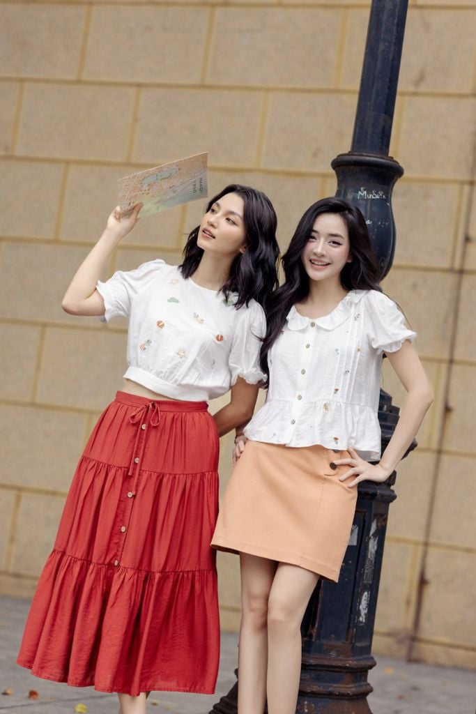 Chân váy mini thô kaki cam khuy kim loại