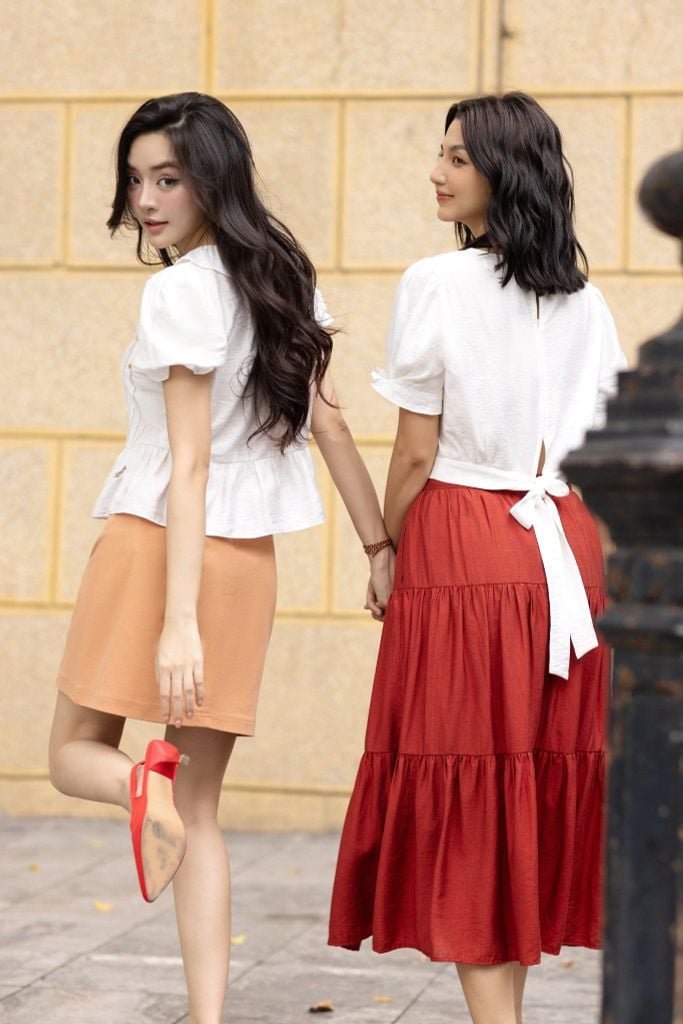 Chân váy mini thô kaki cam khuy kim loại