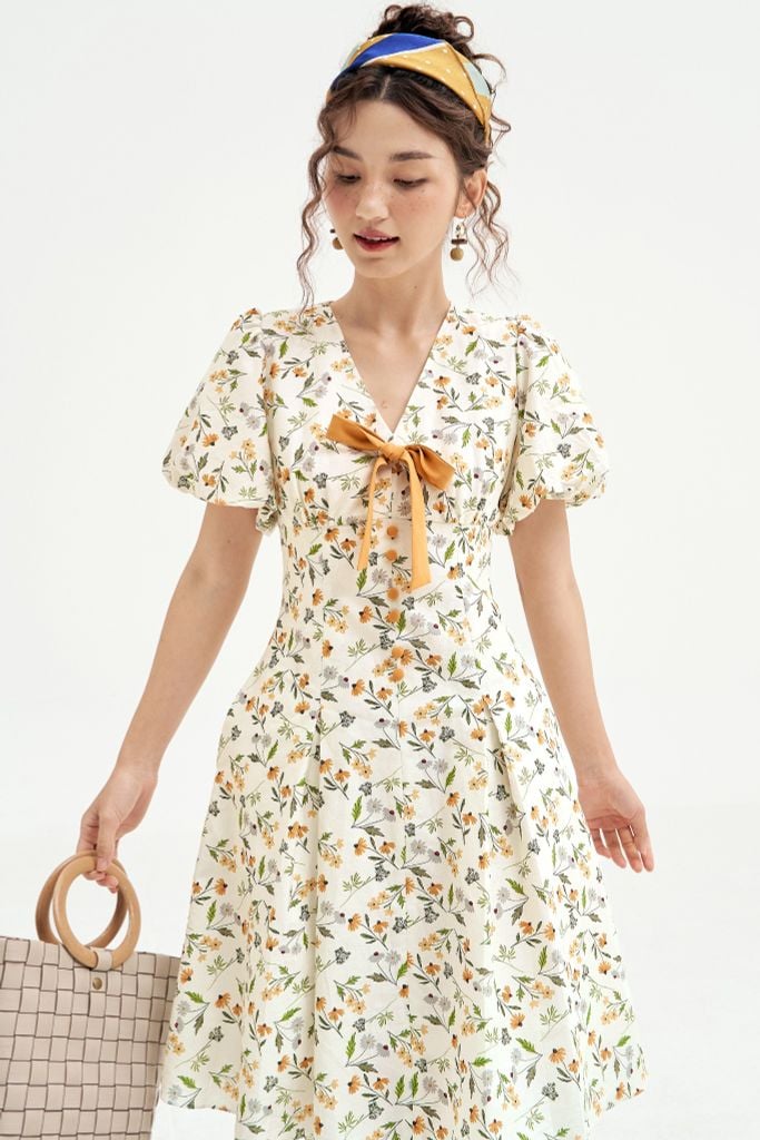 Đầm mini thô lụa hoa daisy vàng nơ cổ