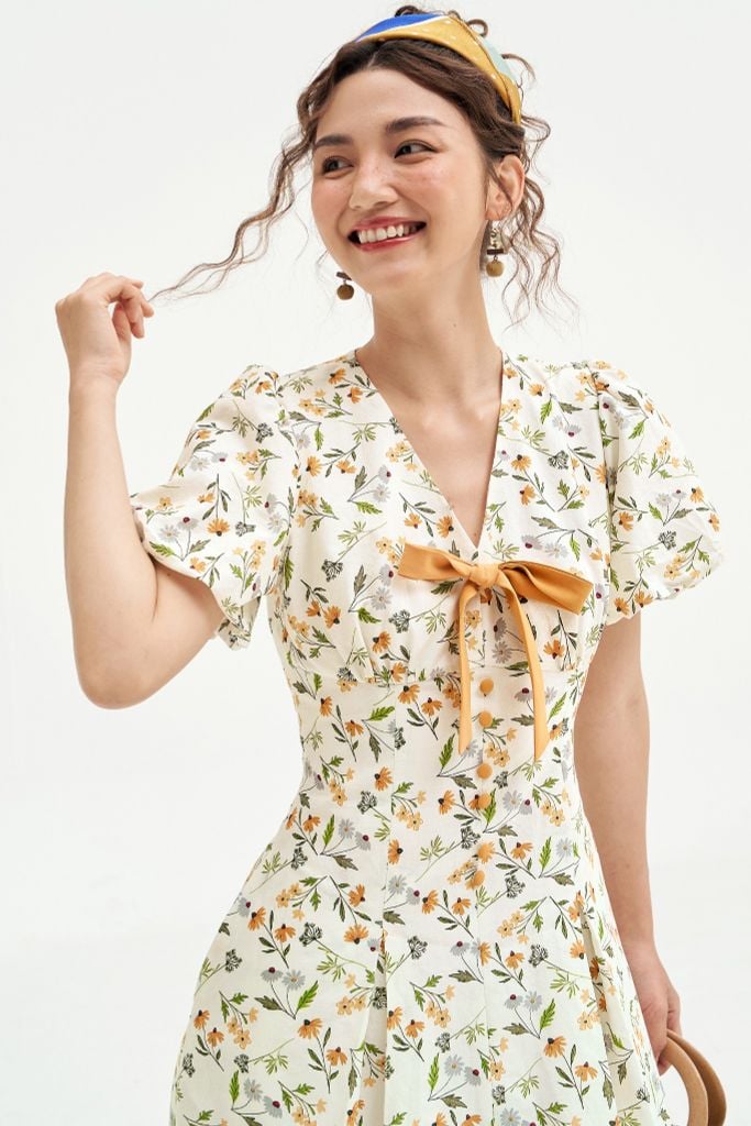 Đầm mini thô lụa hoa daisy vàng nơ cổ