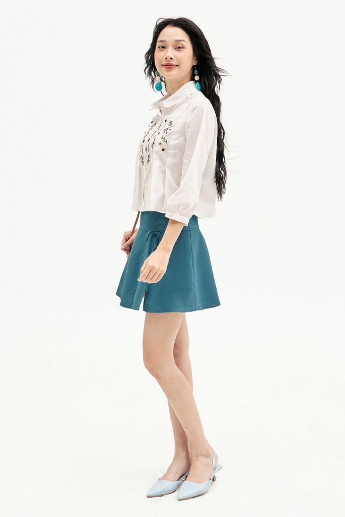 Chân váy mini xoè poly xốp xanh đính nơ