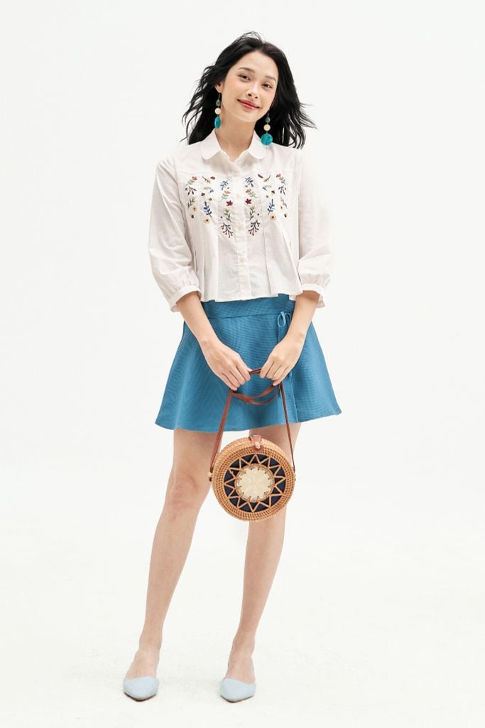 Chân váy mini xoè poly xốp xanh đính nơ