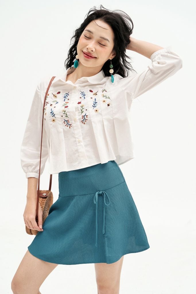 Chân váy mini xoè poly xốp xanh đính nơ