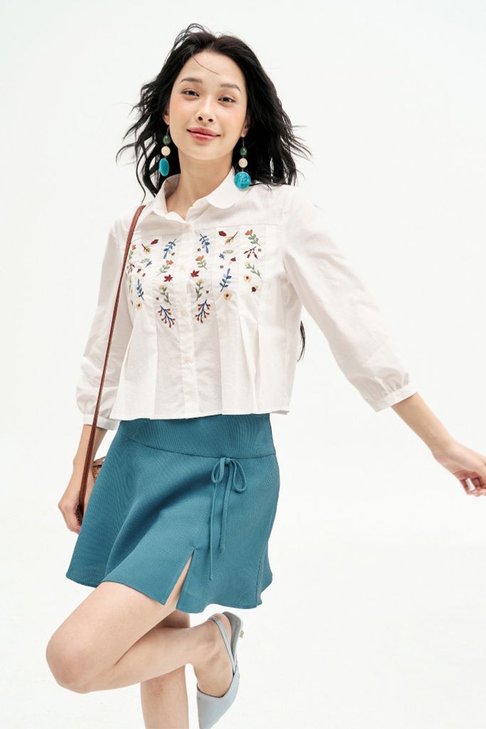 Chân váy mini xoè poly xốp xanh đính nơ