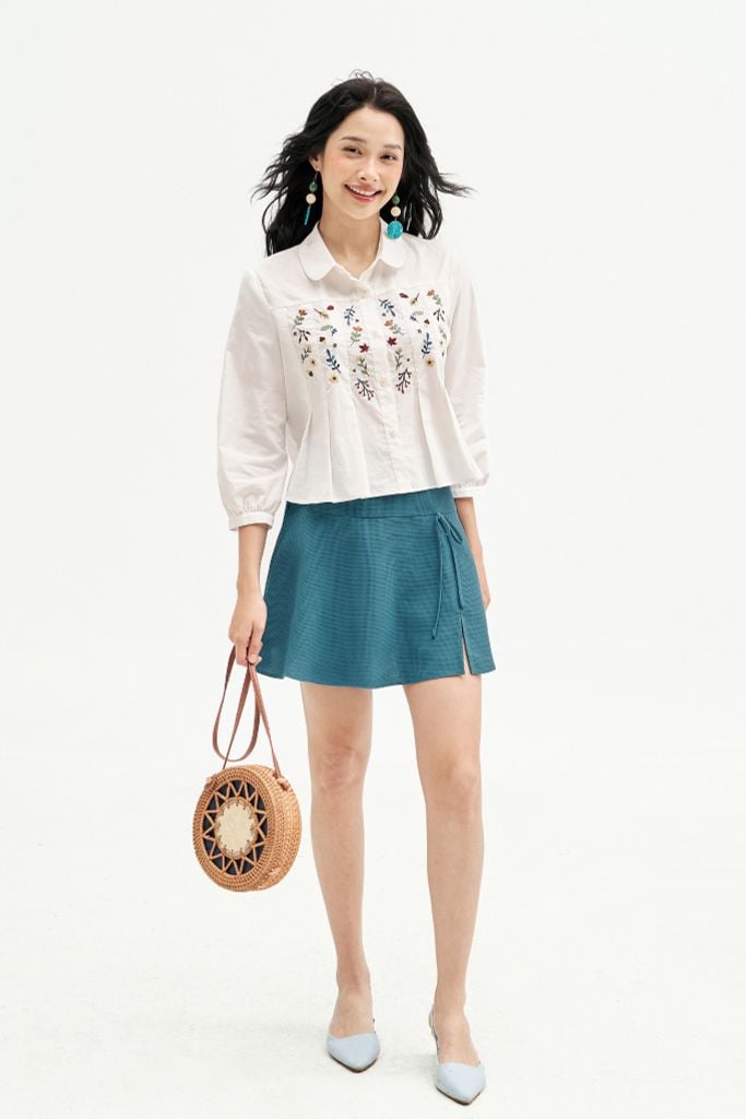 Chân váy mini xoè poly xốp xanh đính nơ