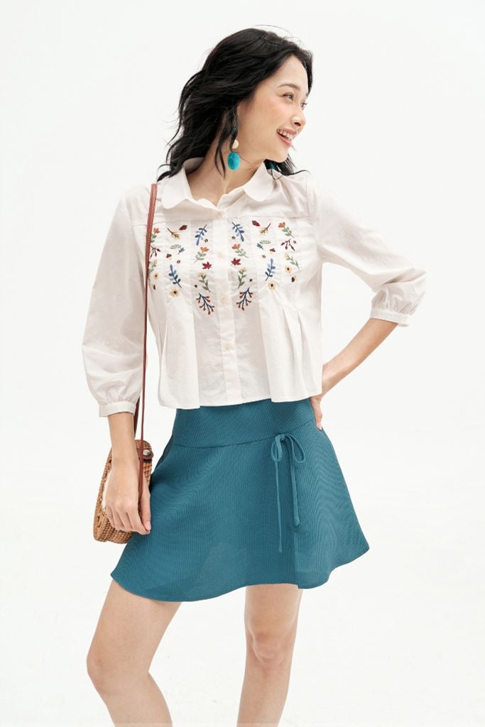 Chân váy mini xoè poly xốp xanh đính nơ