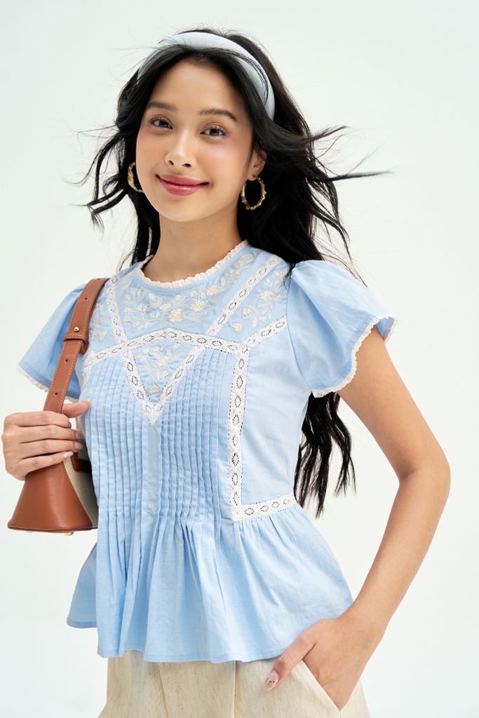 Peplum xanh thêu phối ren trắng