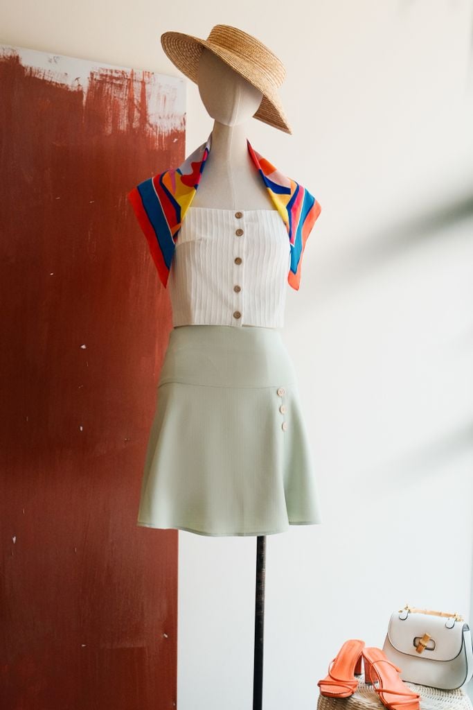 Chân váy mini tech xanh mint đính nơ