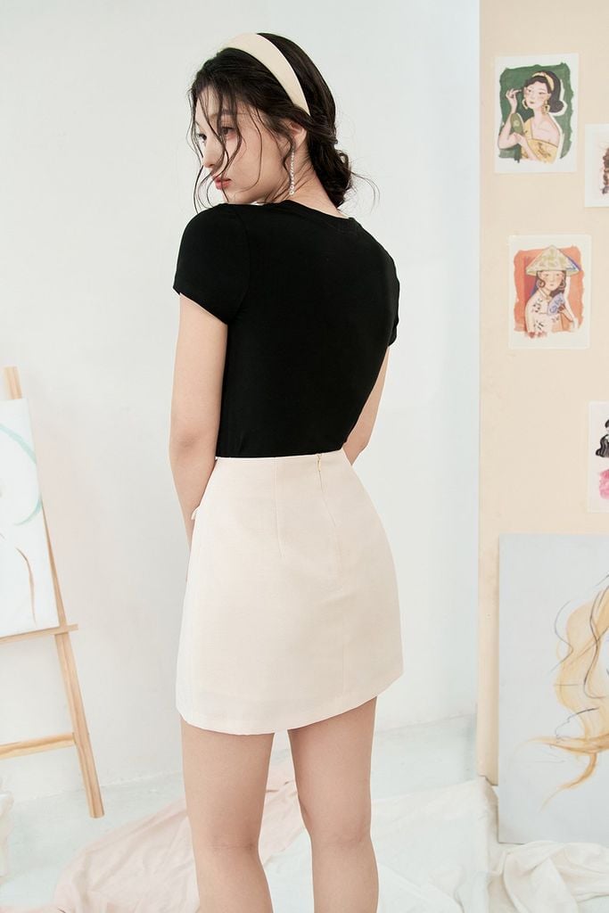 Chân váy mini A trắng kem đính nơ
