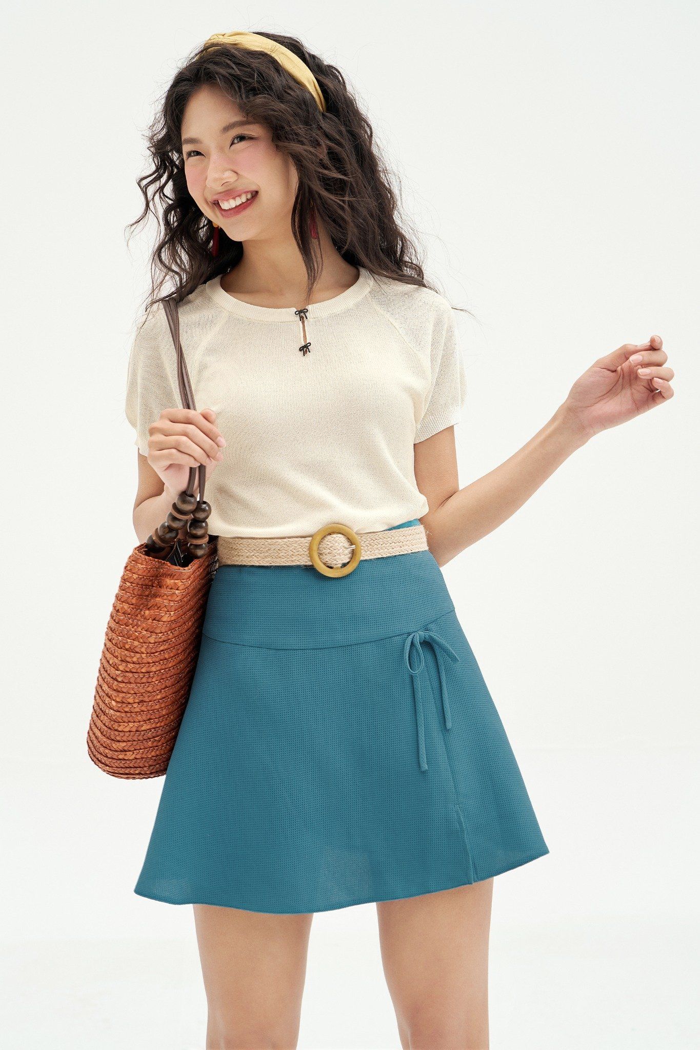 Chân váy mini xoè poly xốp xanh đính nơ