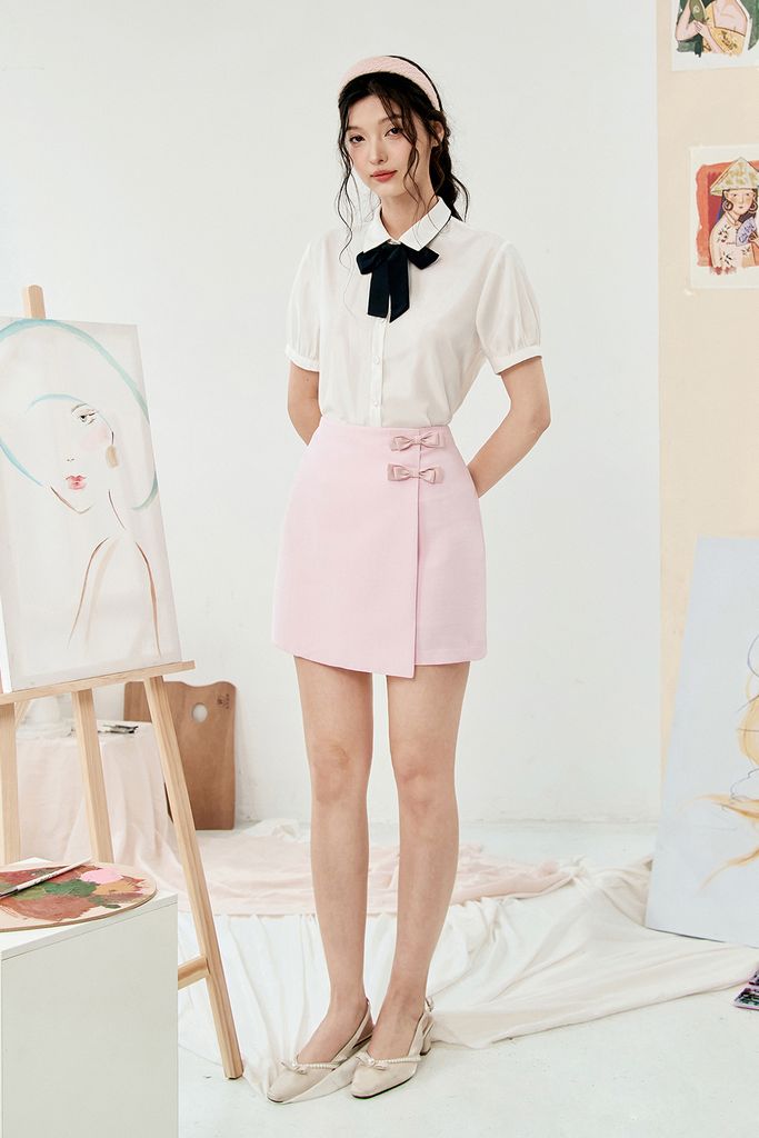 Chân váy mini A tech hồng kem đính nơ