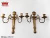 Cặp chân nến 2 nhánh gắn tường được làm bằng đồng.