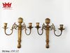 Cặp chân nến 2 nhánh gắn tường được làm bằng đồng.